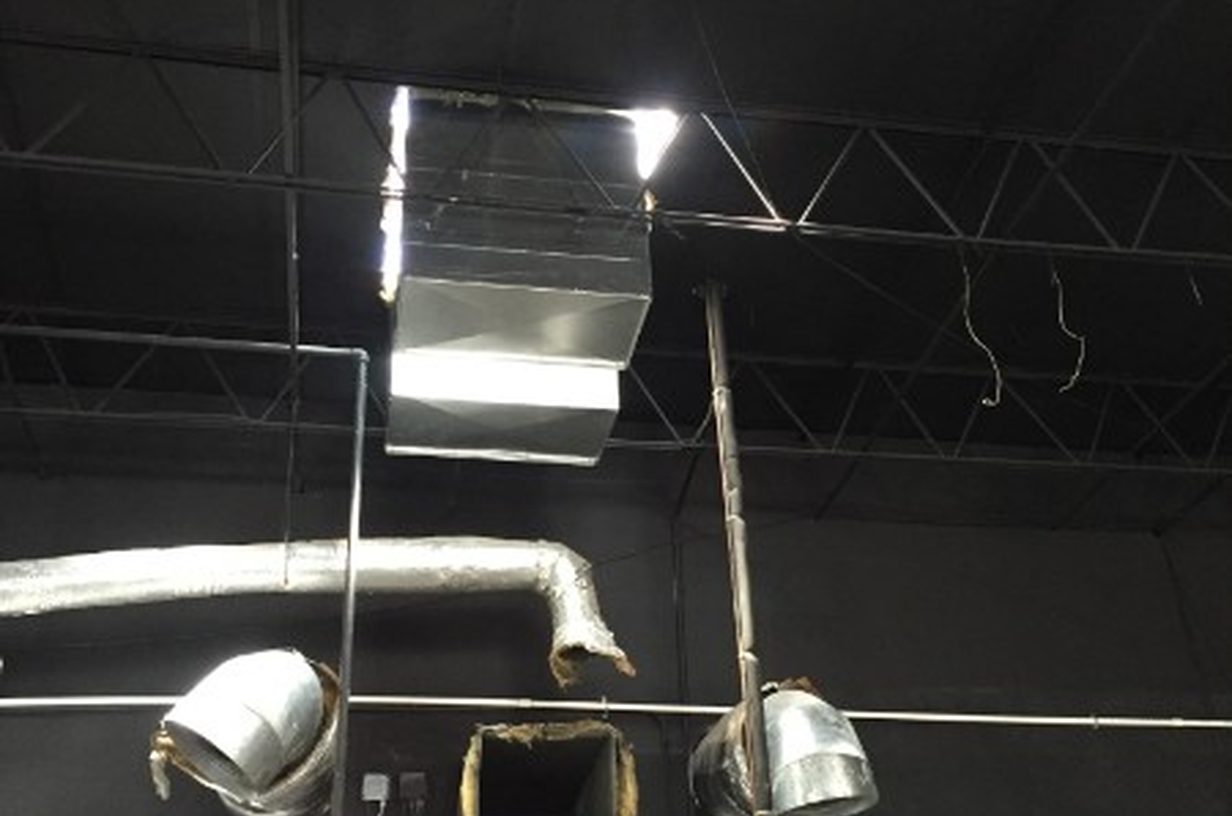 Commercial ductwork and ceiling vents during a build-out
